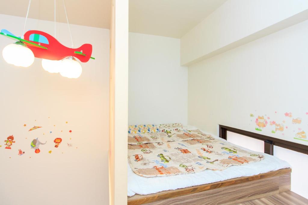 Postel nebo postele na pokoji v ubytování Yilan Dongshan Cypress B&B