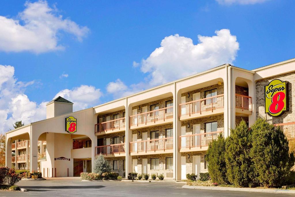 a large building with a hotel at Super 8 by Wyndham Hermitage Nashville in Hermitage