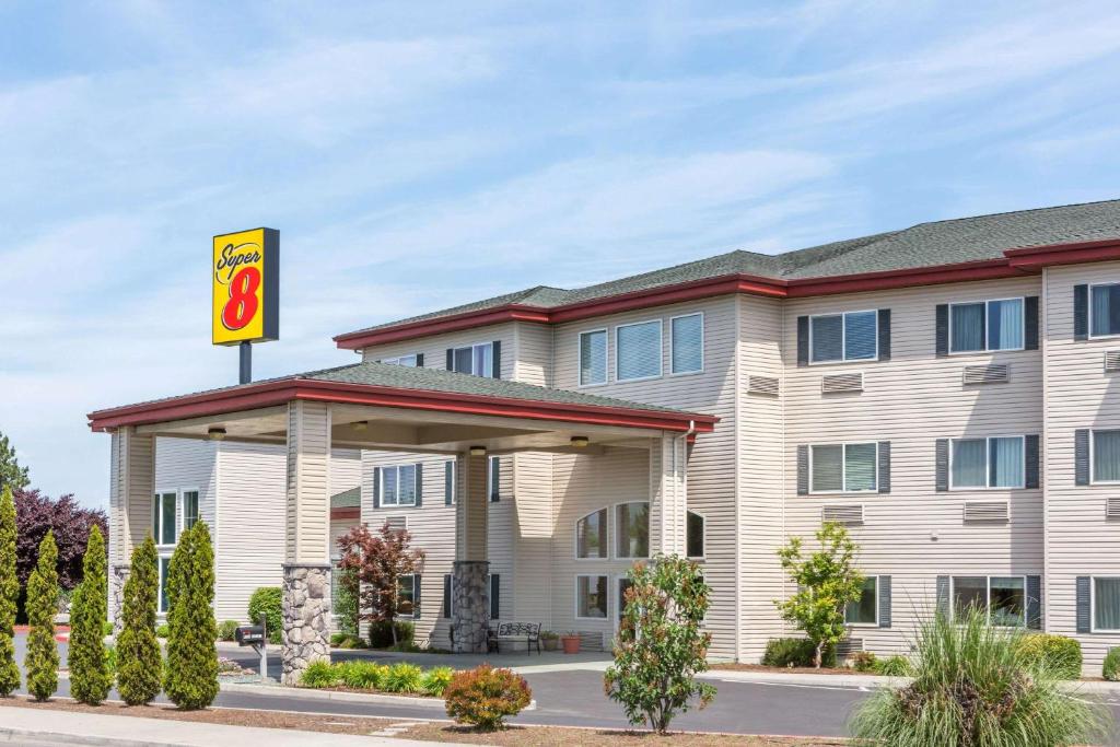 a rendering of a hotel with a gas station at Super 8 by Wyndham Central Pt Medford in Central Point