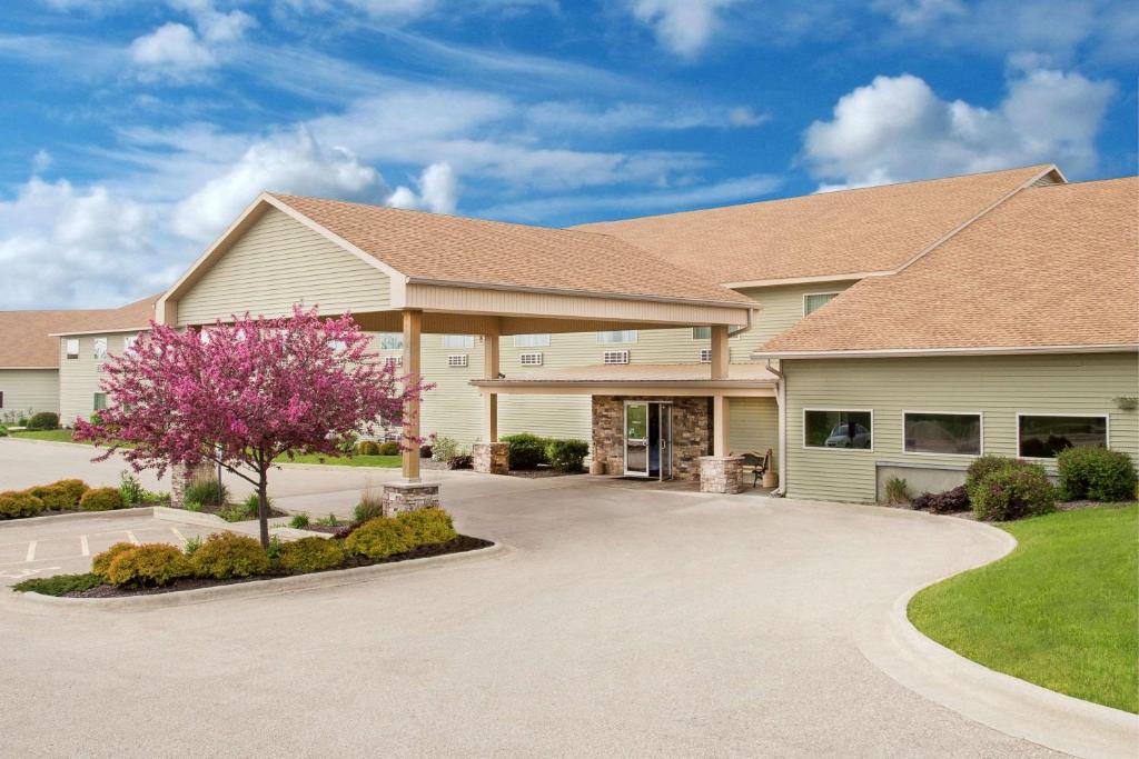 a large house with a driveway in front of it at Darlington Inn in Darlington