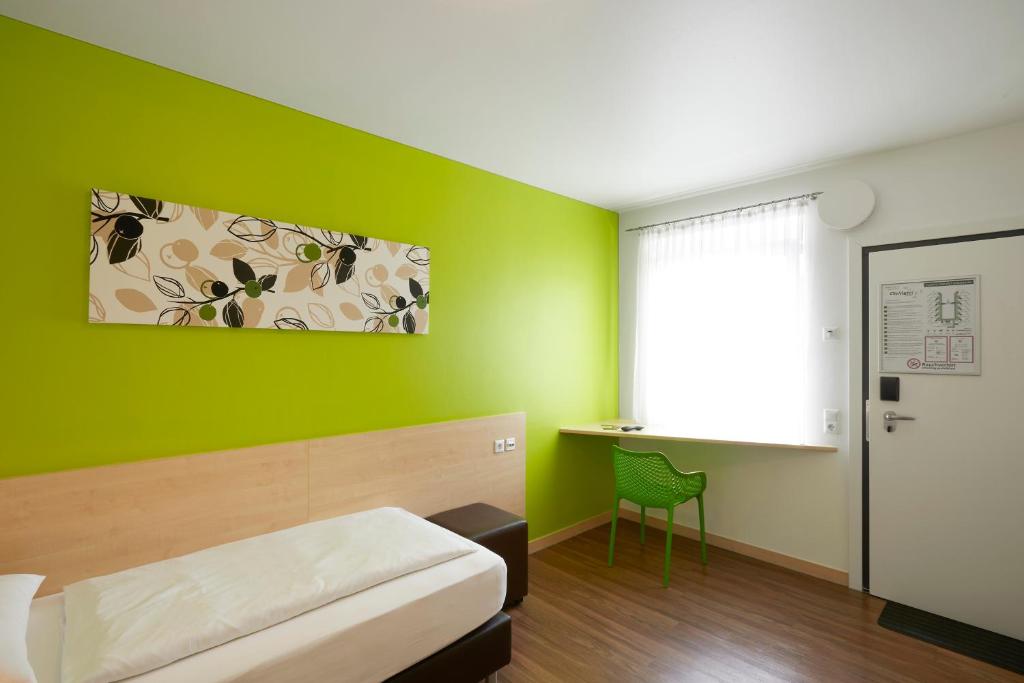 Postel nebo postele na pokoji v ubytování City Motel Soest
