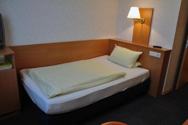 Postel nebo postele na pokoji v ubytování Hotel Bürgerhof