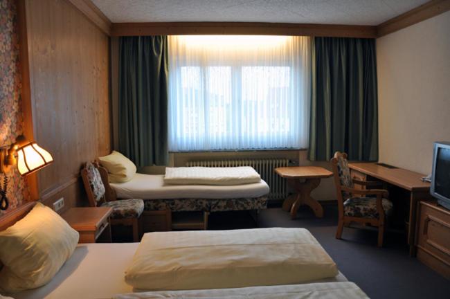 Postel nebo postele na pokoji v ubytování Hotel Bürgerhof