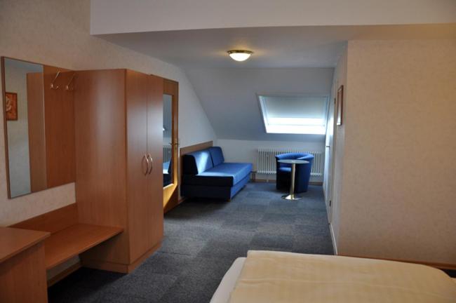 Postel nebo postele na pokoji v ubytování Hotel Bürgerhof