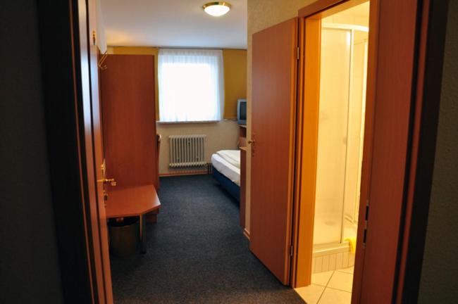 Postel nebo postele na pokoji v ubytování Hotel Bürgerhof