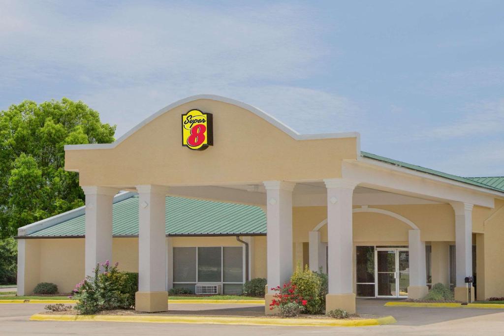 a mcdonalds building with a sign on it at Super 8 by Wyndham Brinkley in Brinkley