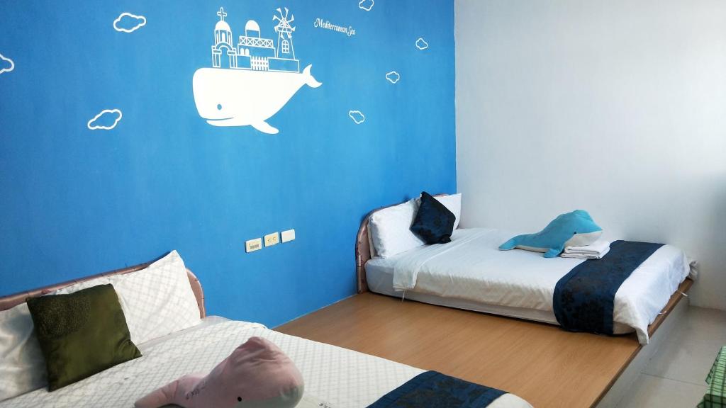 Postel nebo postele na pokoji v ubytování Nandian Homestay