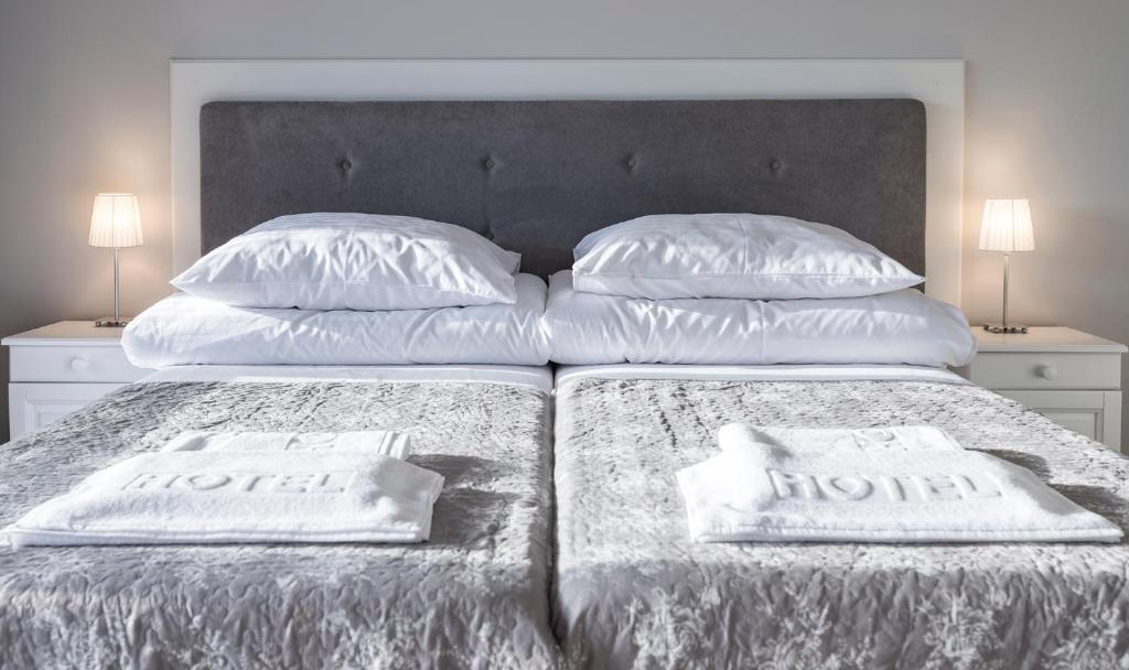 En eller flere senge i et værelse på Bornholm Panorama Apartments