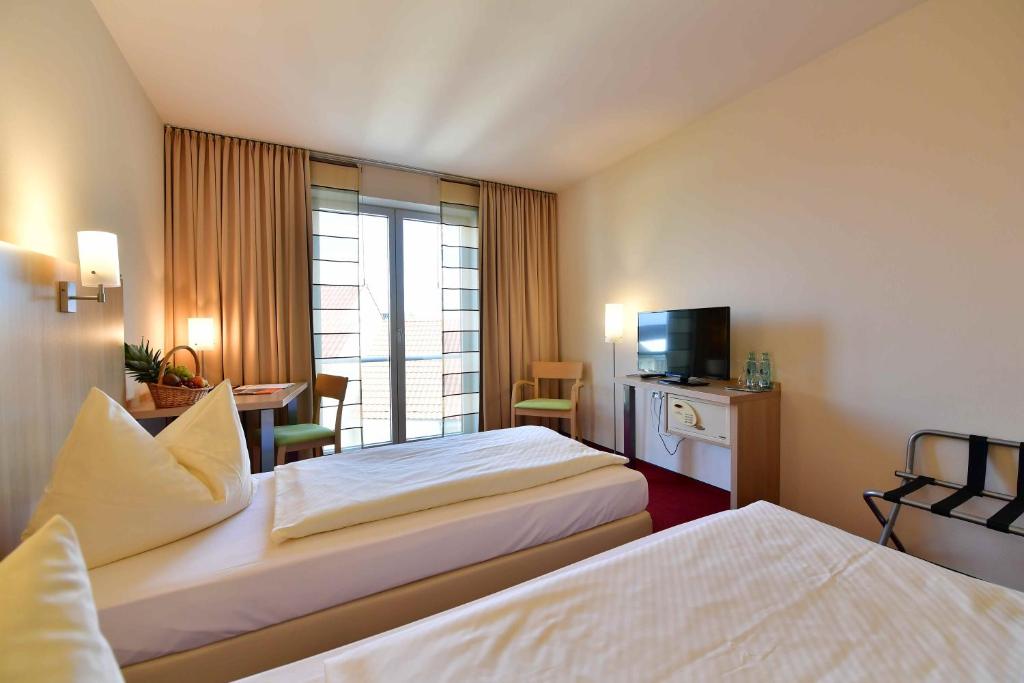 Postel nebo postele na pokoji v ubytování Hotel Aspethera