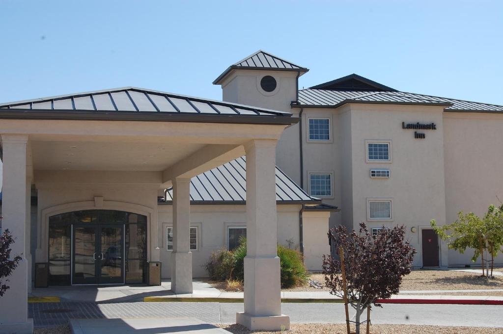 a large building with a large entry way at Landmark Inn Fort Irwin in Fort Irwin
