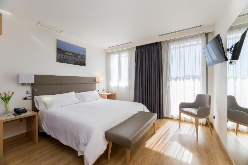 Postel nebo postele na pokoji v ubytování Hotel Palacio de Aiete