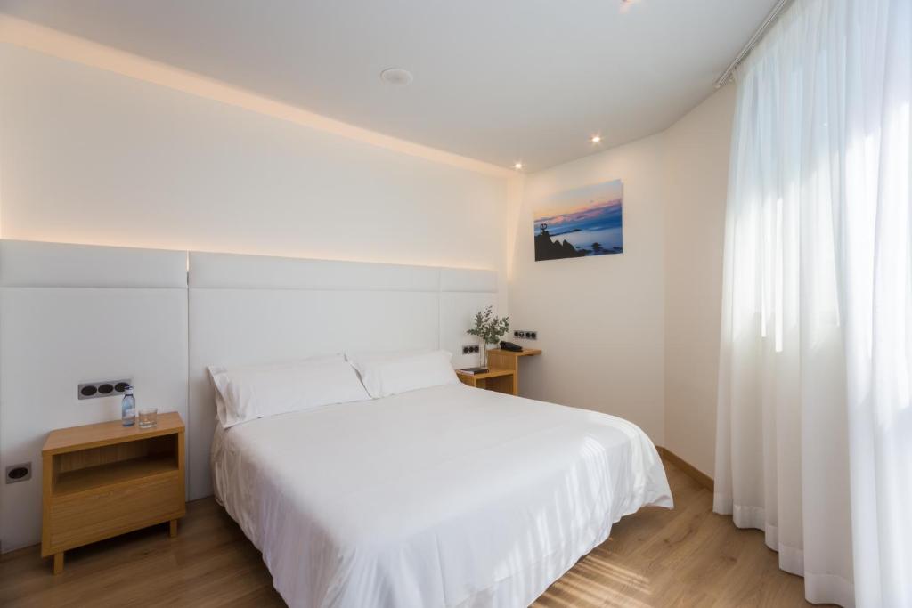 Postel nebo postele na pokoji v ubytování Hotel Palacio de Aiete