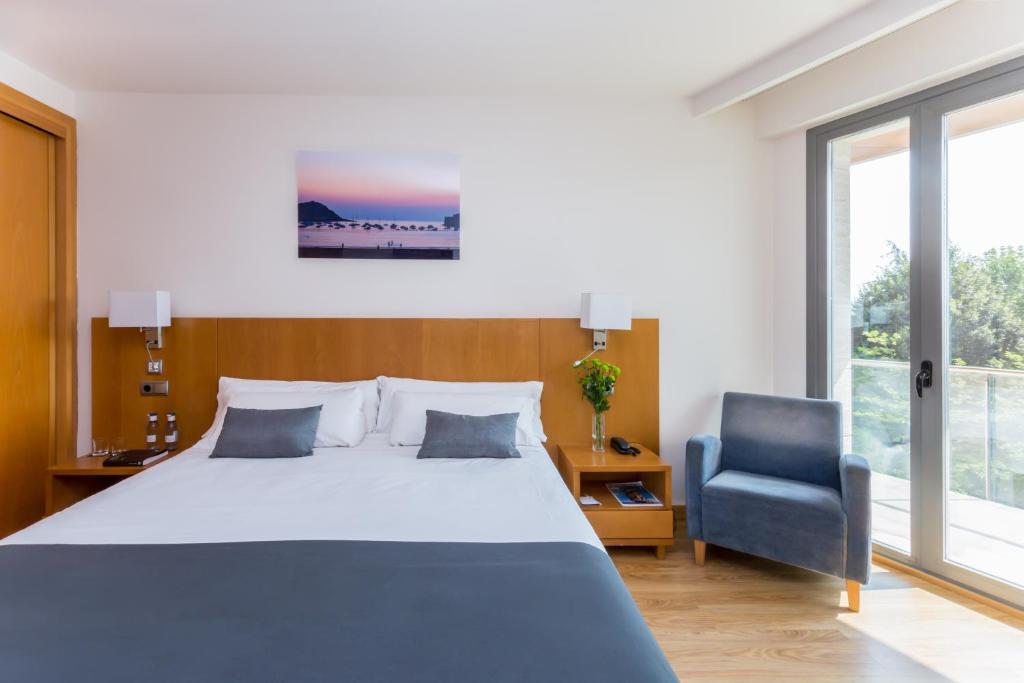 Postel nebo postele na pokoji v ubytování Hotel Palacio de Aiete