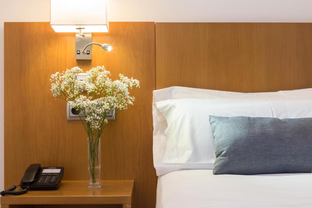 Postel nebo postele na pokoji v ubytování Hotel Palacio de Aiete