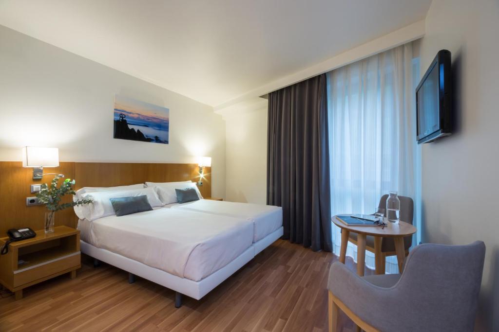 Postel nebo postele na pokoji v ubytování Hotel Palacio de Aiete