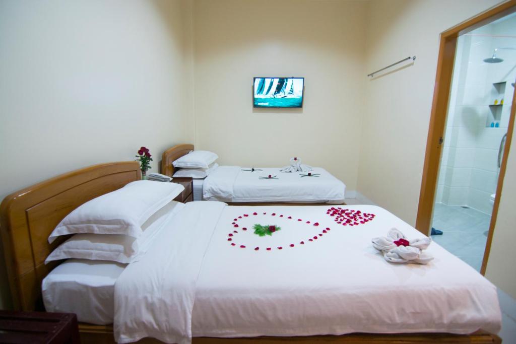 Rúm í herbergi á The Hotel Umbra Bagan