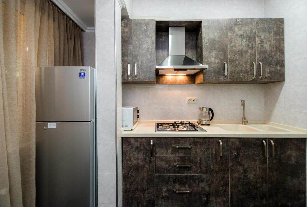 Kuchyň nebo kuchyňský kout v ubytování Star Hotel