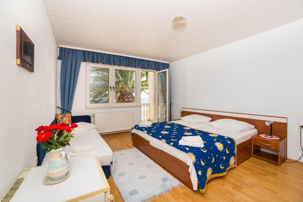 Postel nebo postele na pokoji v ubytování Villa Gomila