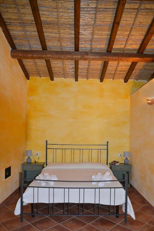 Postel nebo postele na pokoji v ubytování Agriturismo Rubinu