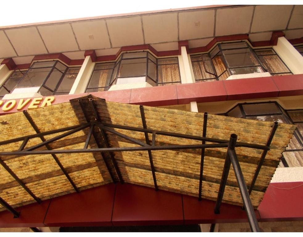 a building with a sign on the side of it at Hotel Mansarovar Palace in Mussoorie