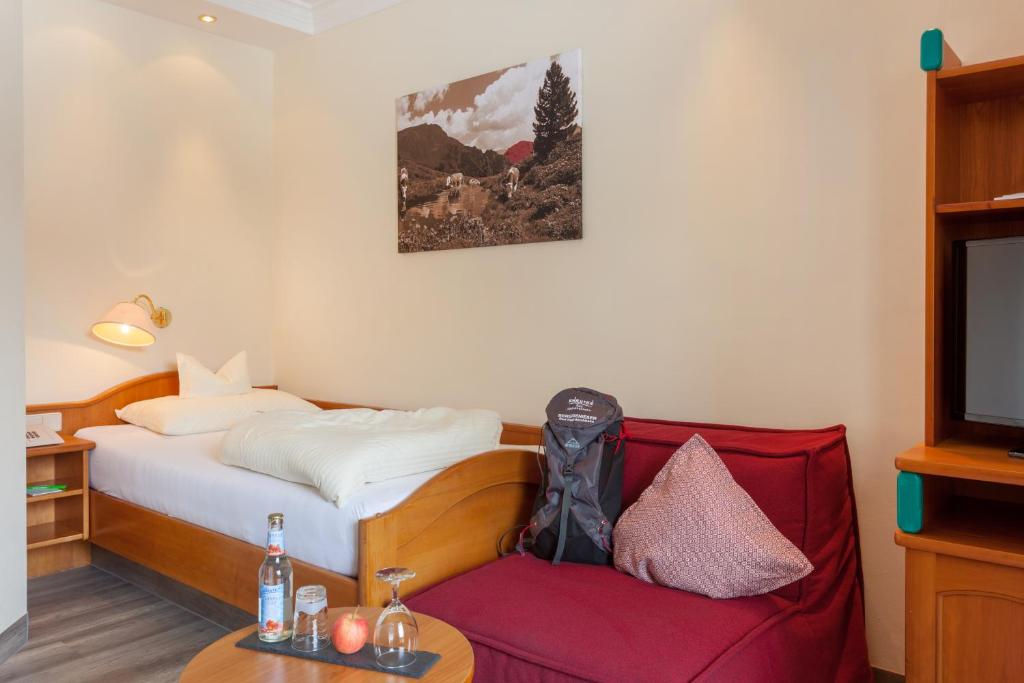 Postel nebo postele na pokoji v ubytování Family & Sporthotel Kärntnerhof
