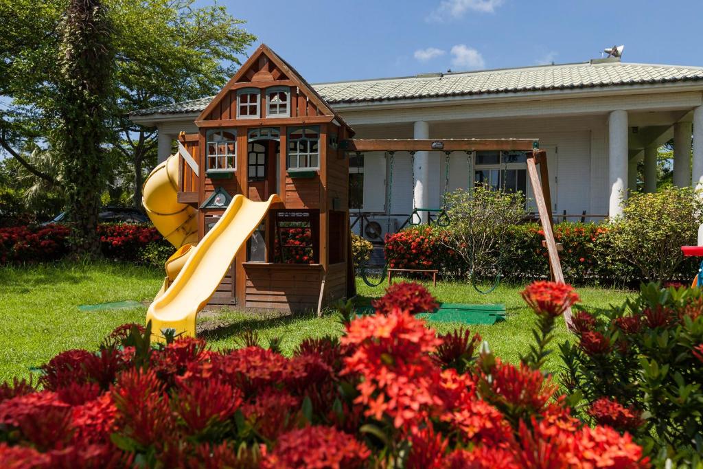 a playground in front of a house with a slide at Sheep House B&amp;B in Ji&#39;an