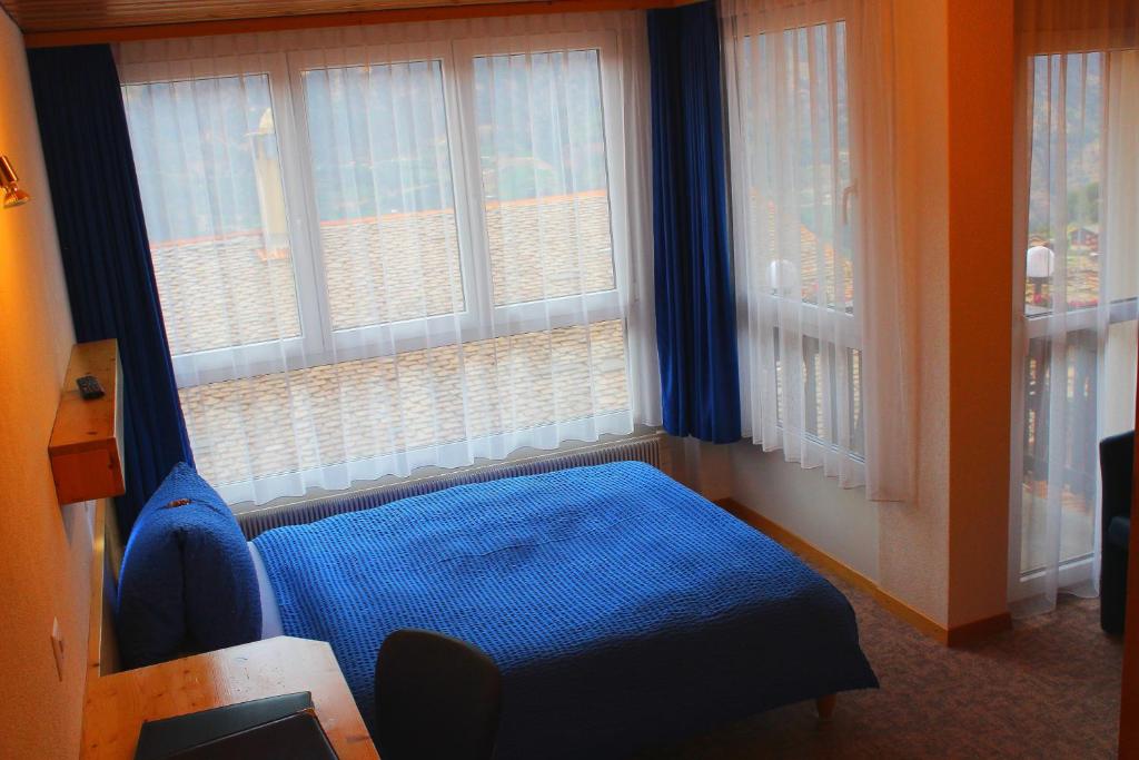 Postel nebo postele na pokoji v ubytování Hotel Alpha