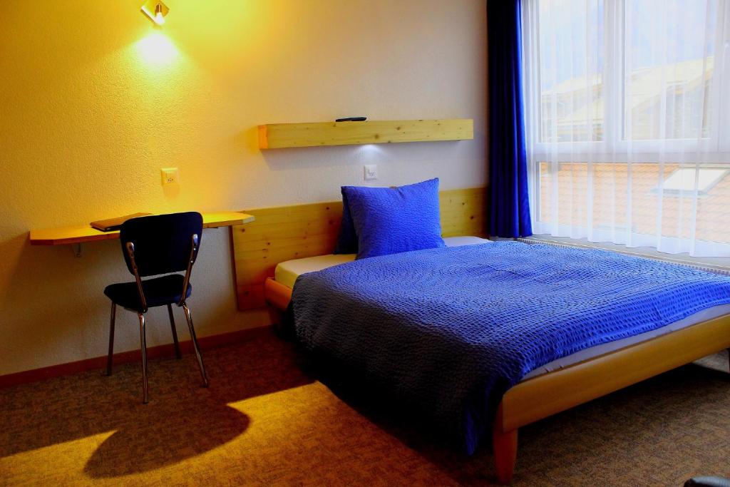 Postel nebo postele na pokoji v ubytování Hotel Alpha
