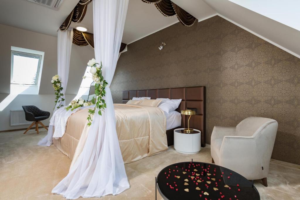 Postel nebo postele na pokoji v ubytování Hotel Panská Zahrada