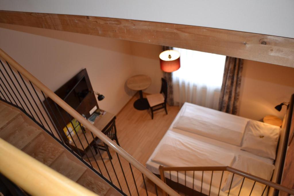 Postel nebo postele na pokoji v ubytování JUFA Hotel Fürstenfeld