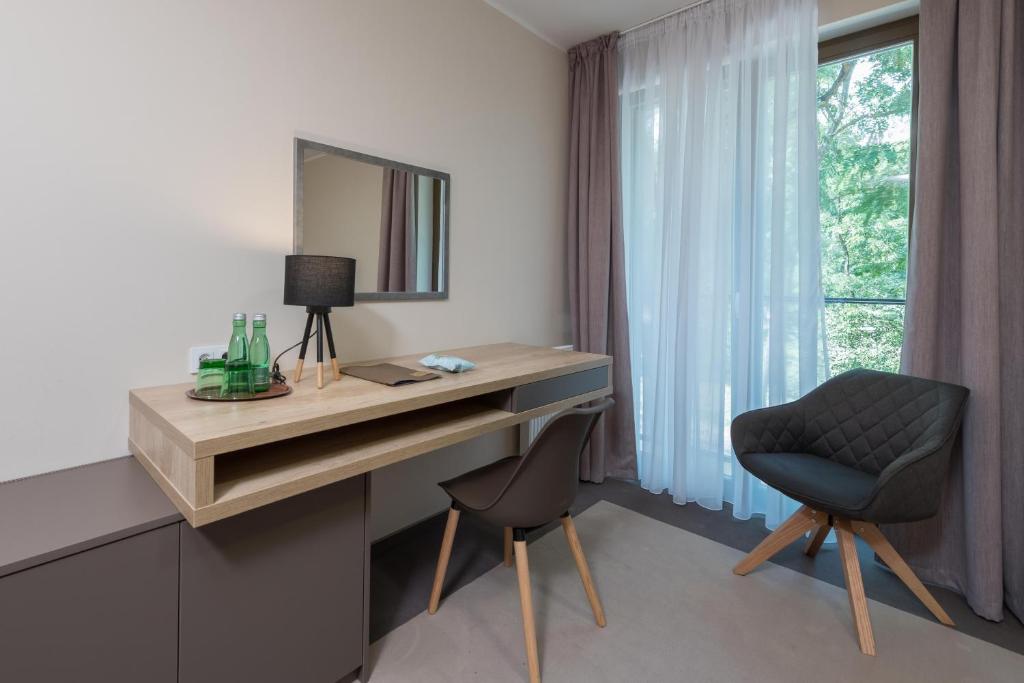 TV a/nebo společenská místnost v ubytování Hotel Panská Zahrada