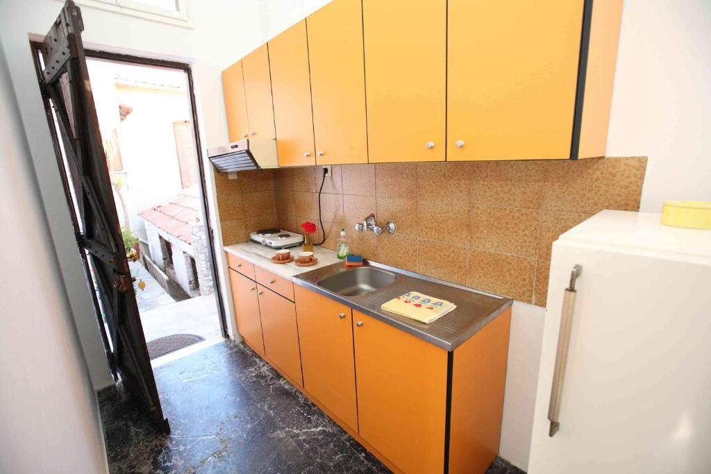 Kuchyň nebo kuchyňský kout v ubytování Mirto Apartments