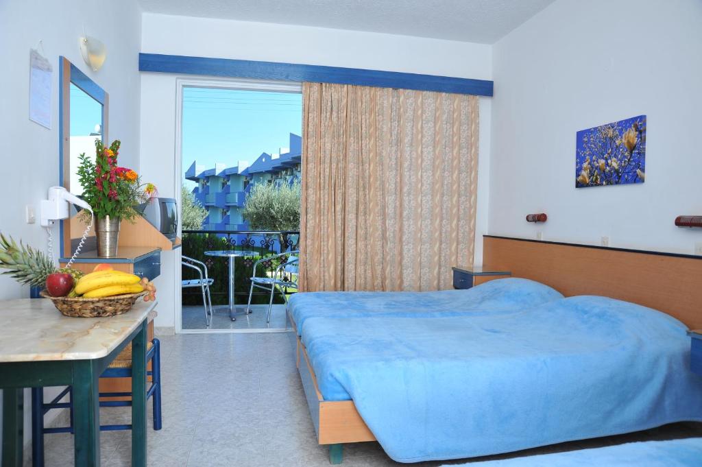 Postel nebo postele na pokoji v ubytování Argiro Village