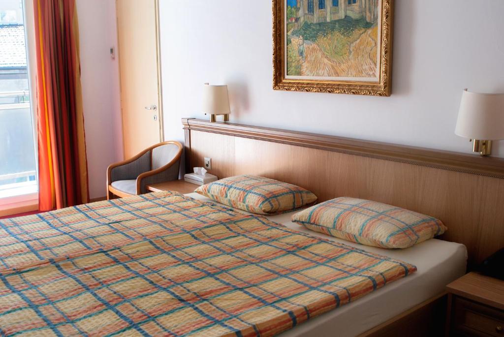 Postel nebo postele na pokoji v ubytování Hotel Dischma - FREE BUS AND TRAIN TICKET