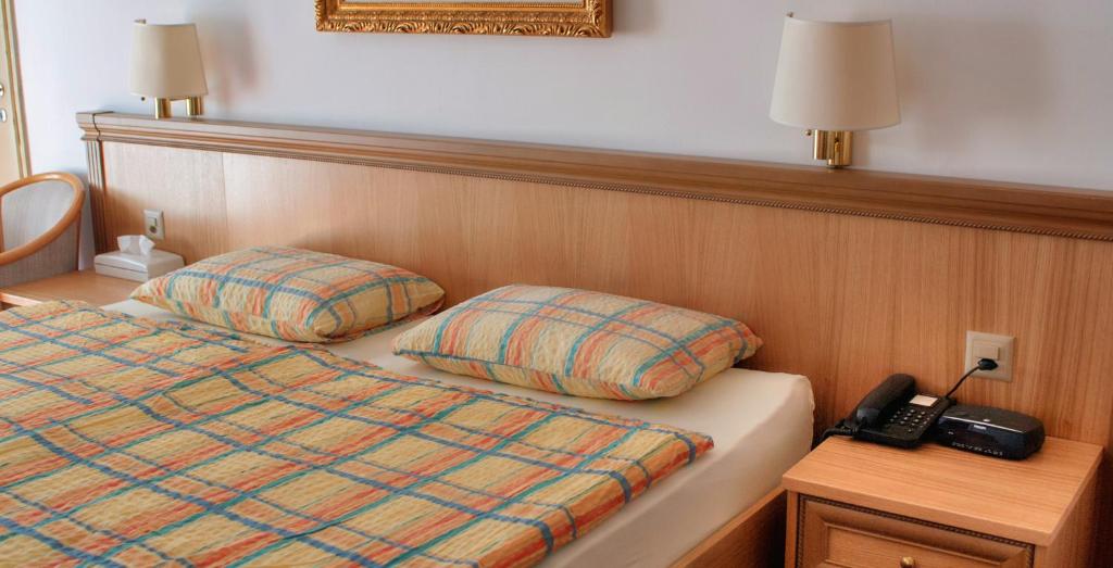Postel nebo postele na pokoji v ubytování Hotel Dischma - FREE BUS AND TRAIN TICKET