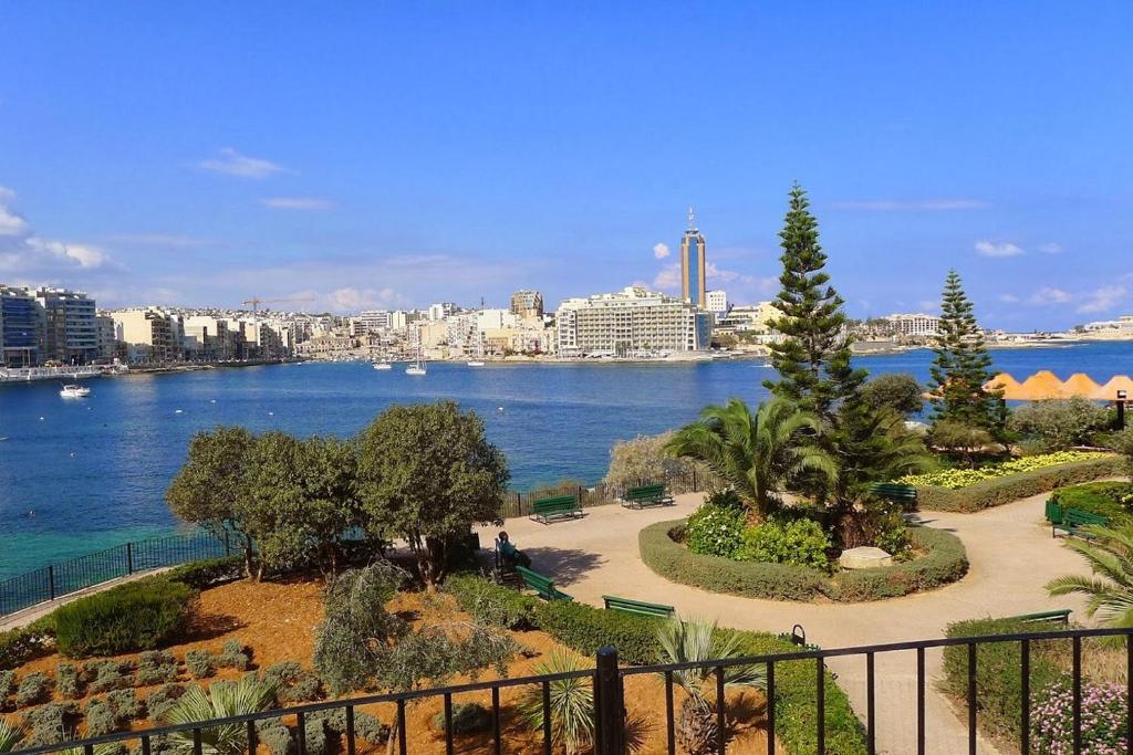 a view of a body of water with a city at Modern 2BR Sliema Apartment in Sliema