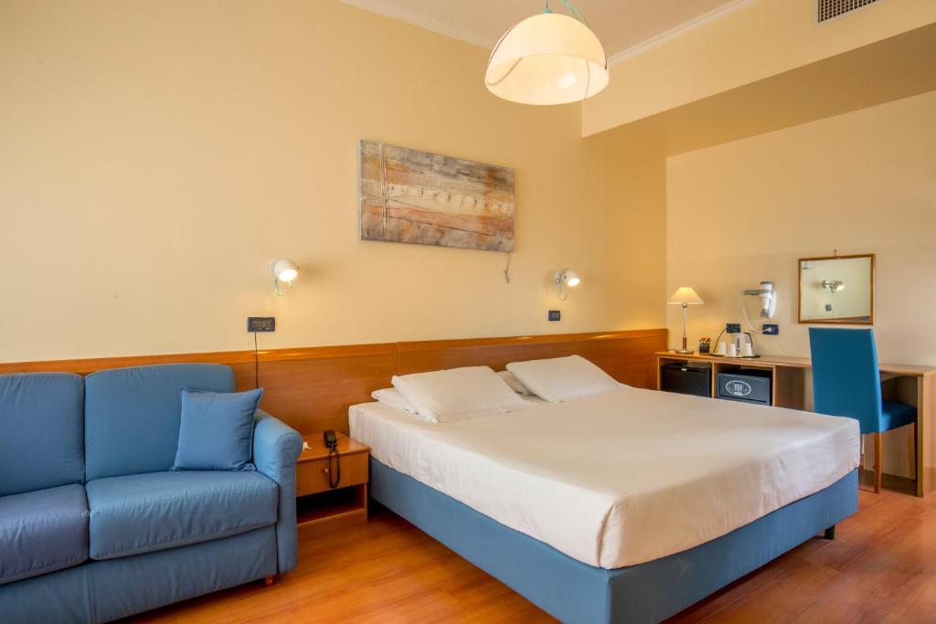 Postel nebo postele na pokoji v ubytování Best Western Hotel Globus