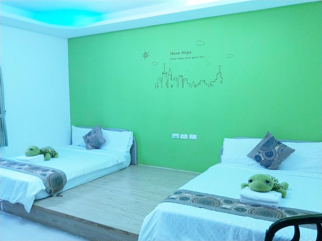 Postel nebo postele na pokoji v ubytování Nandian Homestay