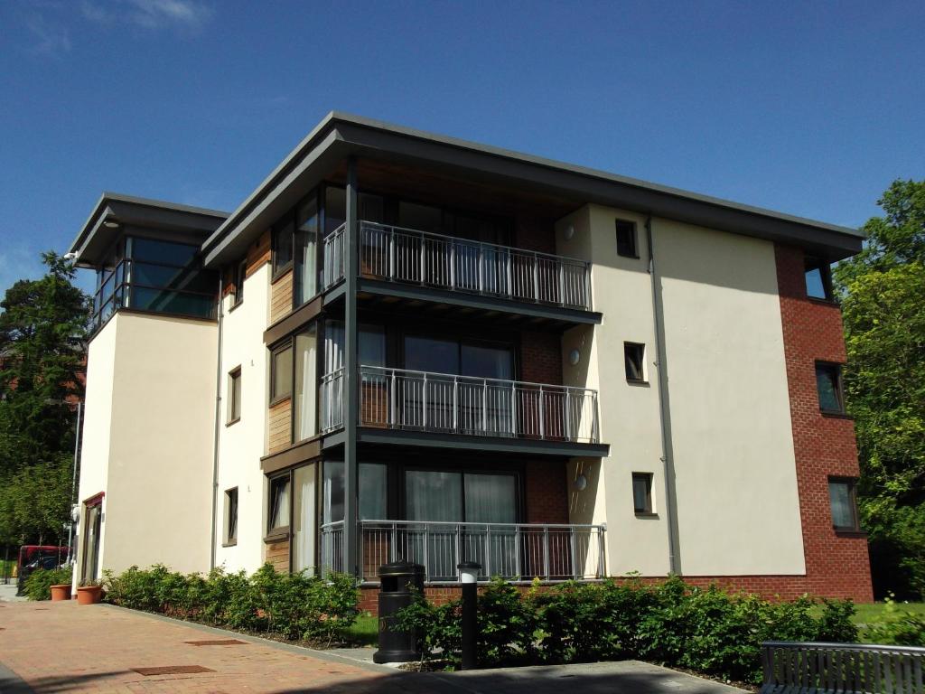 an apartment building with balconies on the side of it at Perth Youth Hostel and Apartments in Perth