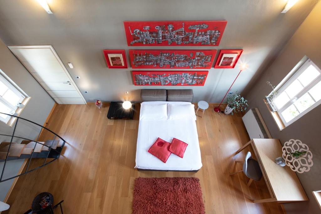 Postel nebo postele na pokoji v ubytování Klinec Plešivo Art Rooms