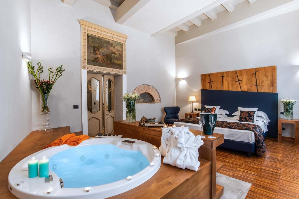 a large bathroom with a tub in a room at The Code Hotel in Rome