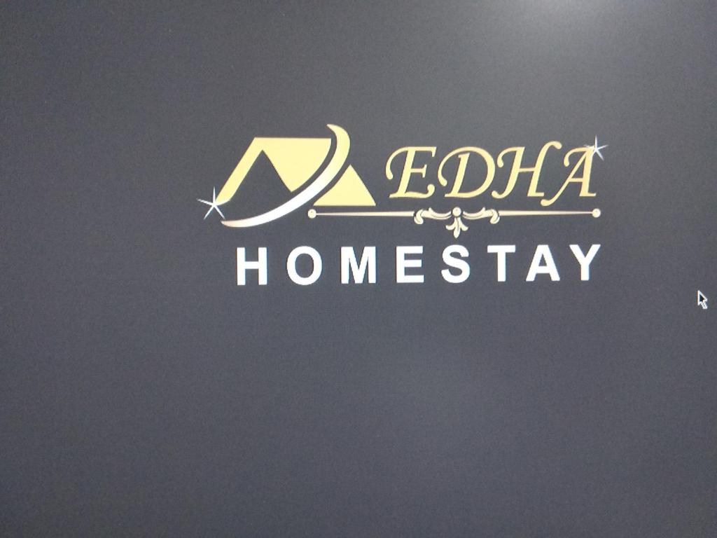 a sign that reads egypt homesay with a crescent at Edha Homestay in Port Blair