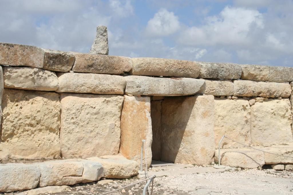 a stone wall with a chimney on top of it at Modern 2BR Sliema Apartment in Sliema