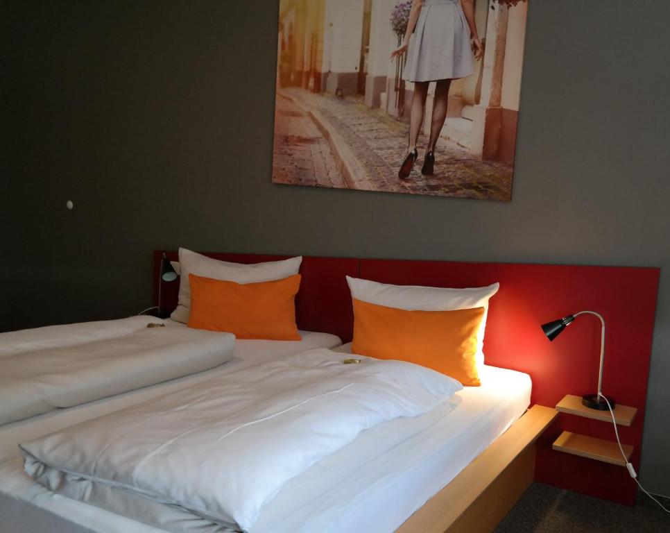 Postel nebo postele na pokoji v ubytování GS Hotel Mindelheim