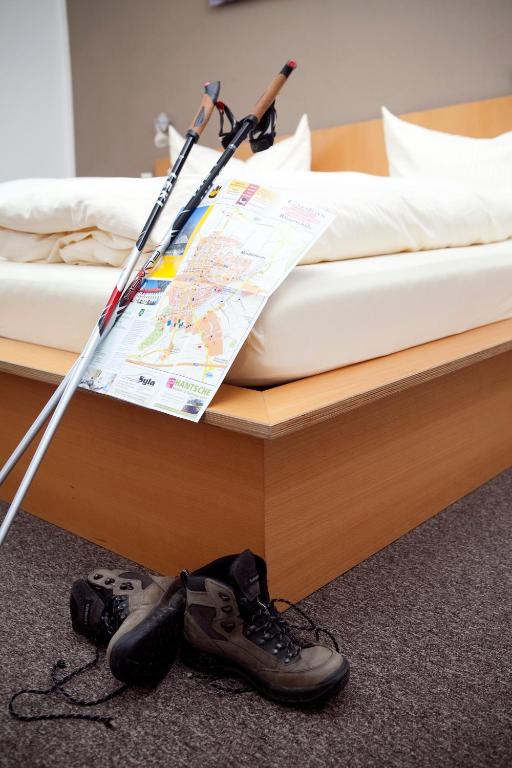 Postel nebo postele na pokoji v ubytování GS Hotel Mindelheim