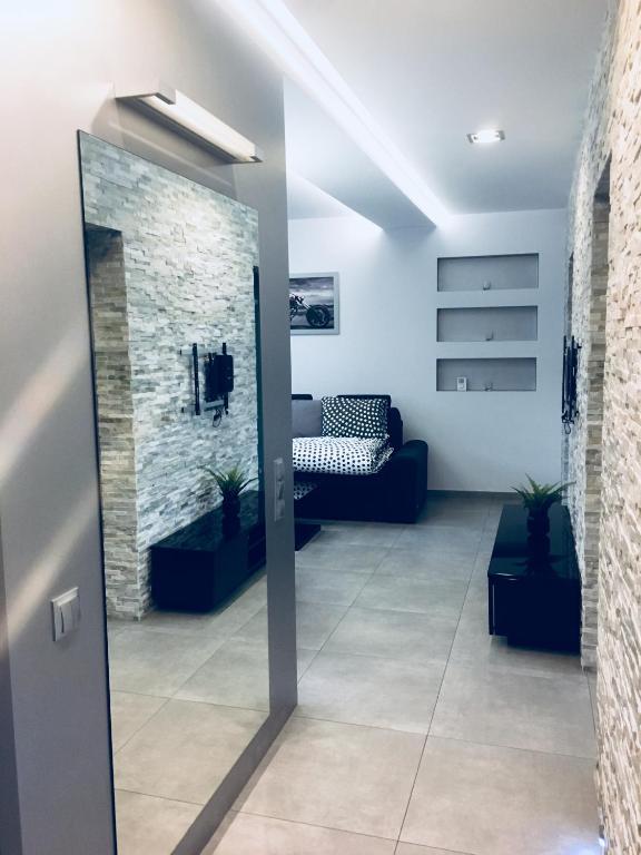 Posteľ alebo postele v izbe v ubytovaní Apartament Ala