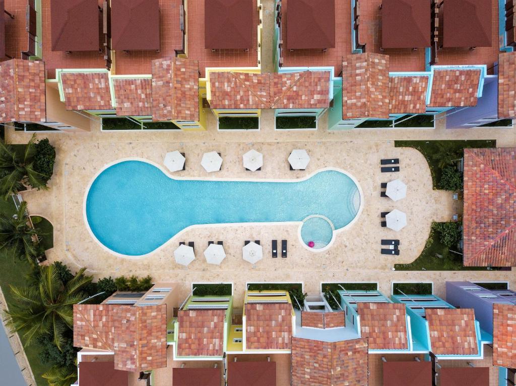 an aerial view of a resort with a swimming pool at Los Flamencos Aparthotel Beach Club in Bayahibe