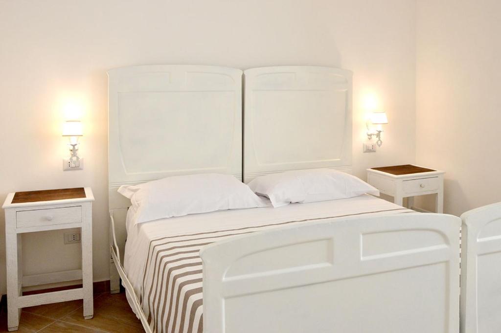 A bed or beds in a room at B&B PALAZZO MARZO