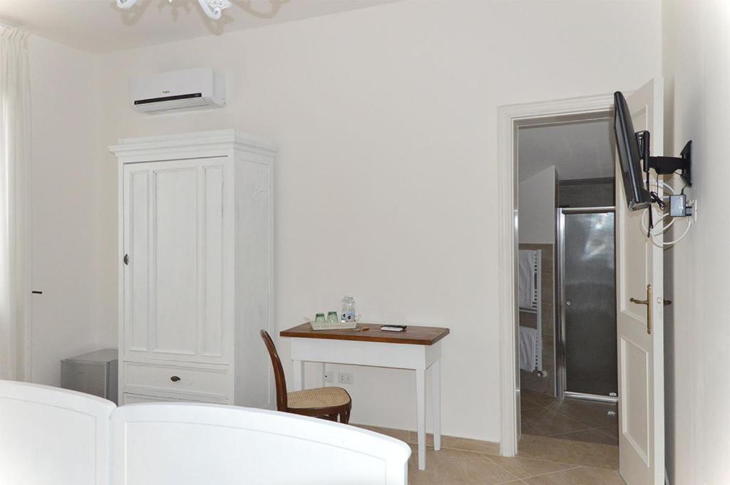 A bed or beds in a room at B&B PALAZZO MARZO