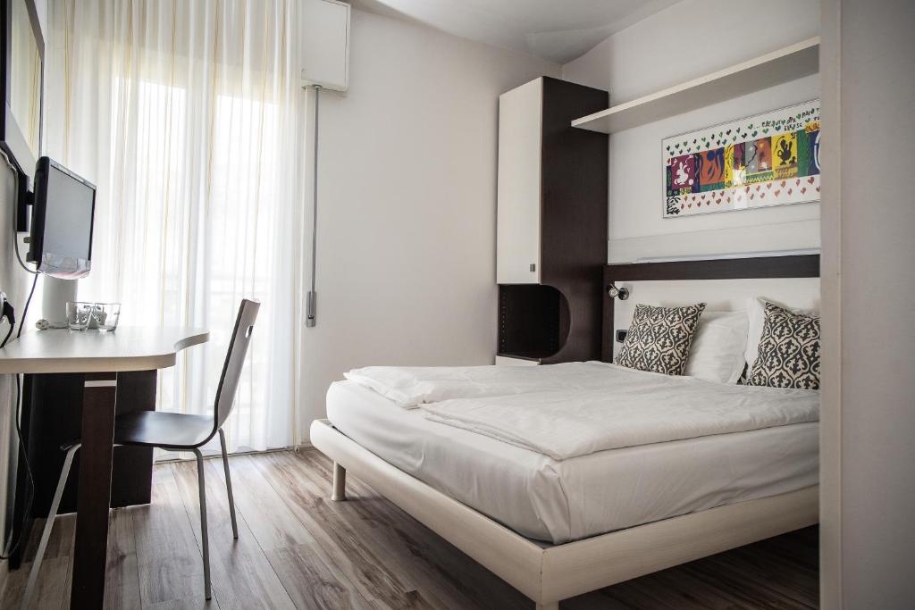 Postel nebo postele na pokoji v ubytování Hotel Villa Alberta